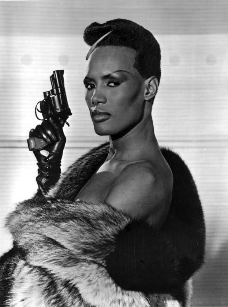 Amazon.com: Grace Jones Holding Pistol in Classic Photo